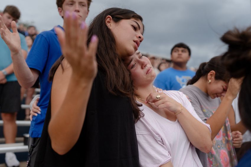 Community members attend a vigil for the victims of the floods at the Antler Stadium in Kerrville on Wednesday July 9, 2025.