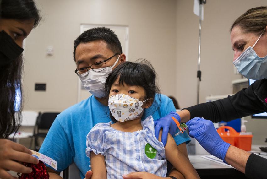 Mary Douglas injects Huaijin Zhang, 5, with the Moderna COVID-19 vaccine in Texas Children’s Hospital on June 28, 2022, in Houston.